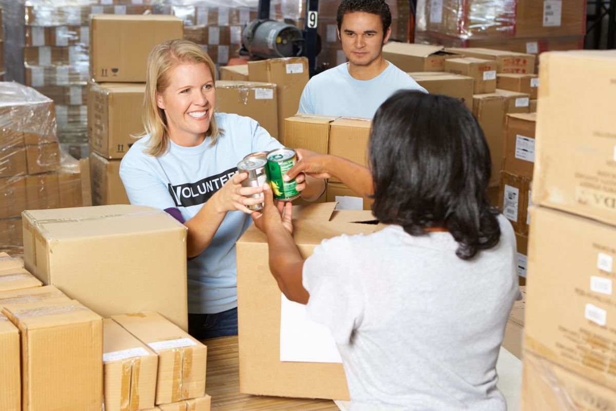 People interacting at a food bank.